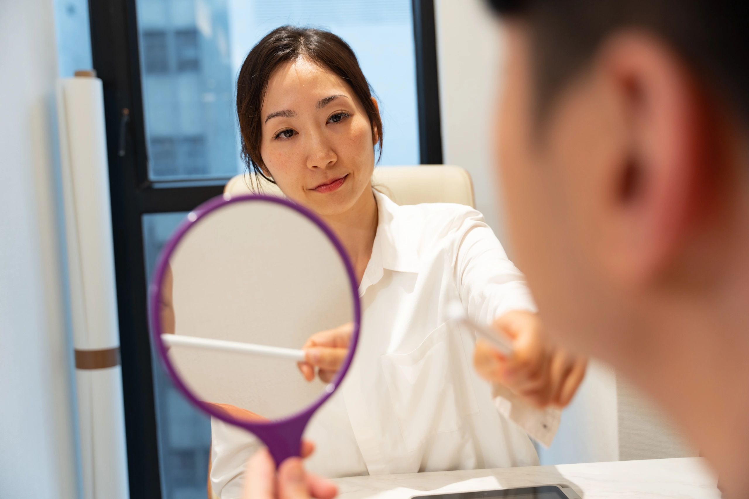 Aesthetic consultation with client and doctor