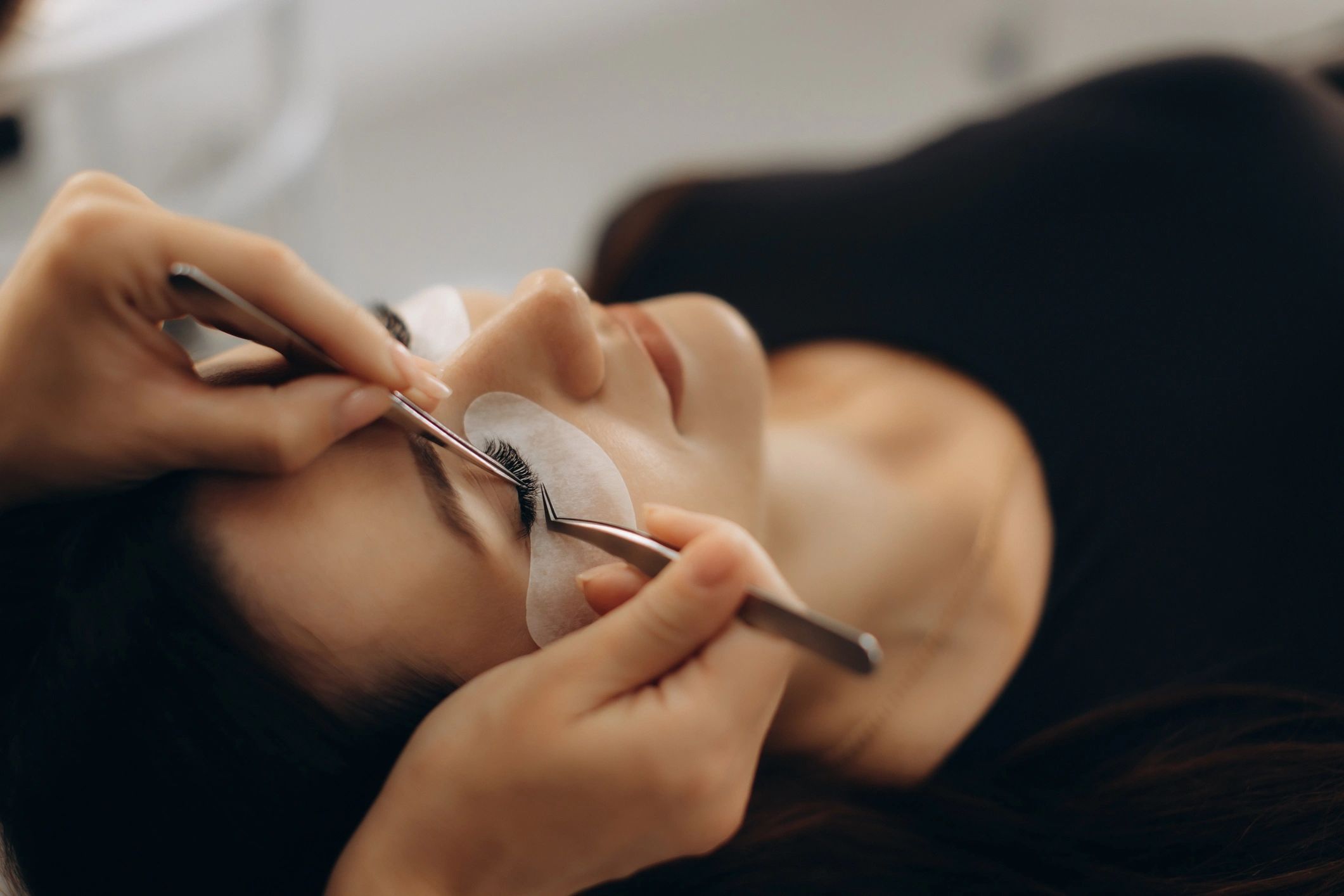 Professional lash extension procedure in salon